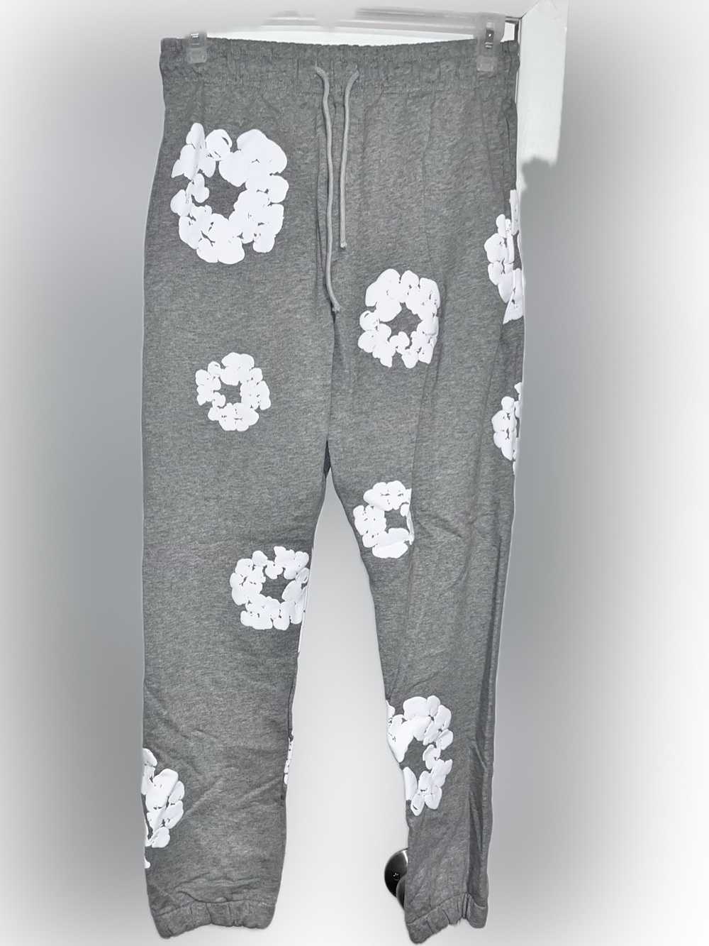 Gray Lounge sweats joggers Pants with White Floral Rings by denim tears Africa
